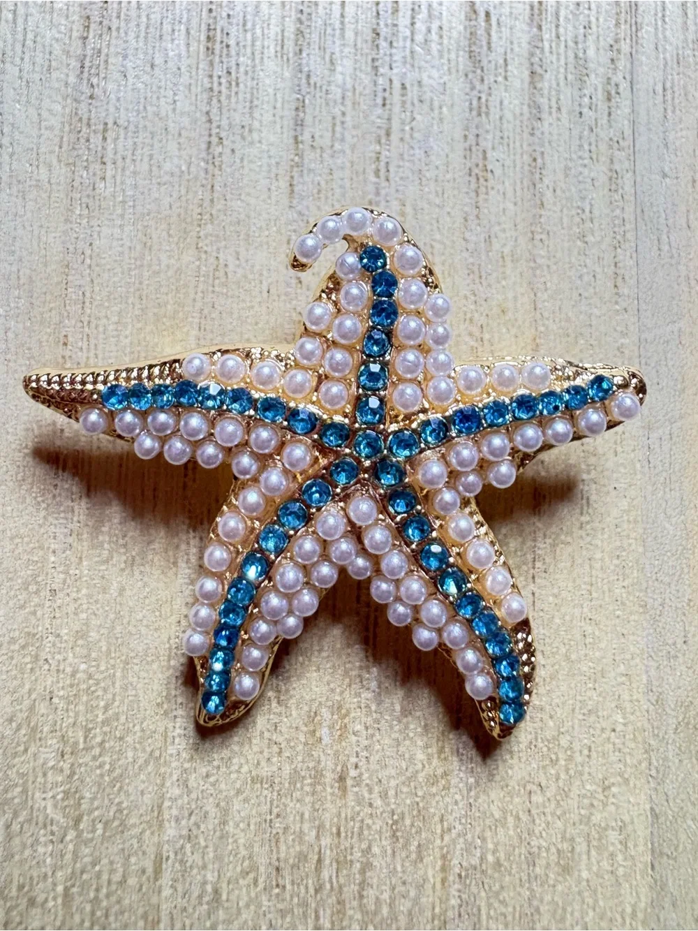 Gold Starfish Brooch with Blue Crystal Accents and Pearl Detail